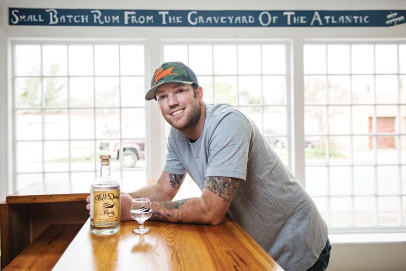 Scott Smith ’05 and three friends recently opened the first ‘legal’ rum distillery in the Outer Banks. Photo by Daniel Pullen.