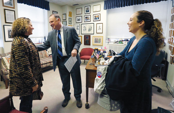 Erica Hilscher Garvey ’08 (right) and her mother, Beth Hilscher, meet with state Sen. R. Creigh Deeds in his office, as part of their annual lobbying efforts for improved mental health services.